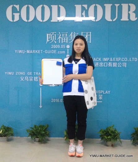 professional guide / translator in Yiwu market with a white board