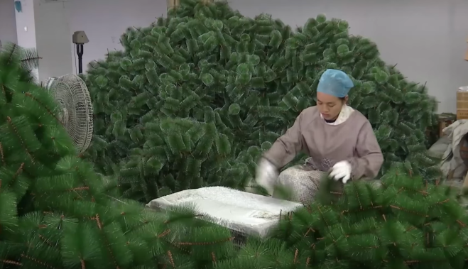 A worker is making Christmas tree in factory, Yiwu, China