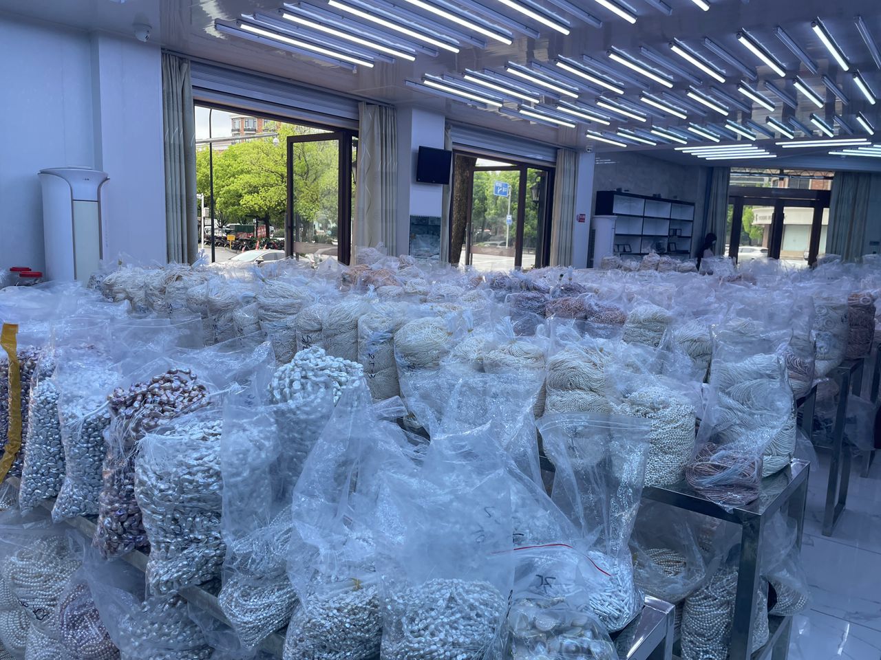 A pearl supplier outside of zhuji pearls market, China.