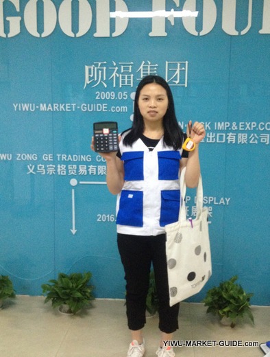 professional guide / translator in Yiwu market with calculator, tape measure, scale... and many more
