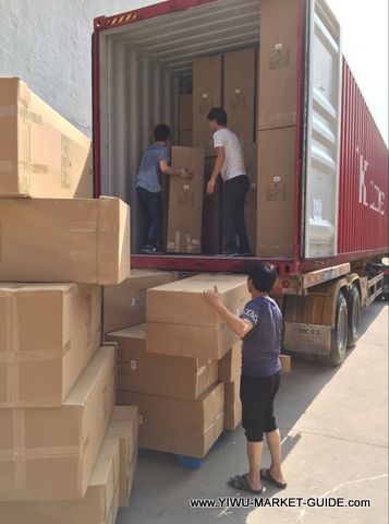 corrugated paper display filled with products, fully packed, then loaded into container.