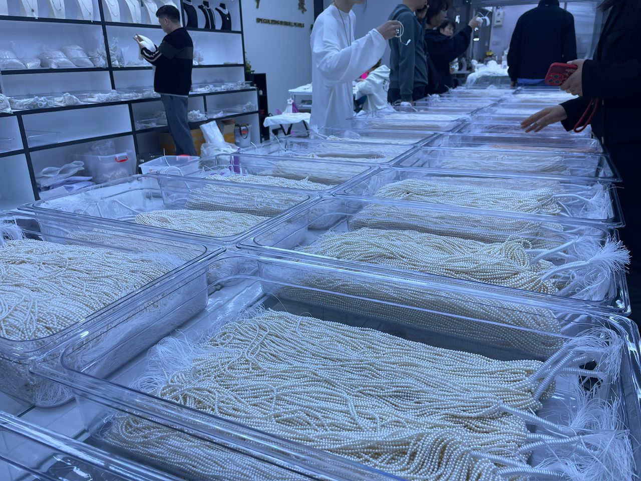 A shop in Zhuji pearls market offering small pearls wholesale, ready stock.